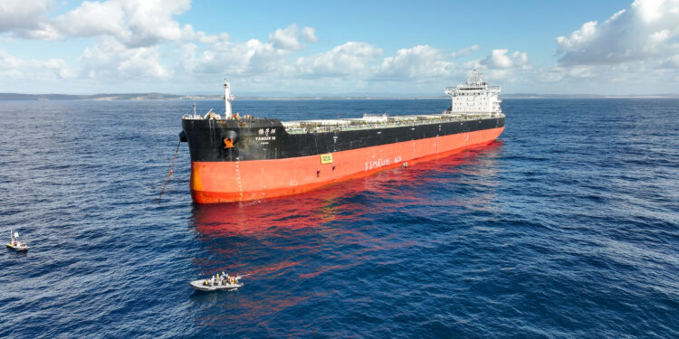 Greenpeace activists block coal ship from entering world’s largest coal port at Rising Tide blockade.