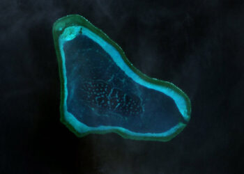 China blames military drills for reef damage around disputed shoal